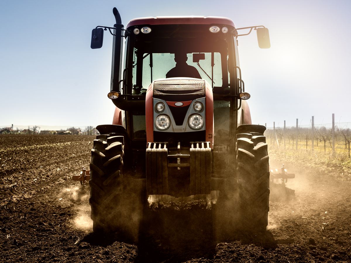 Tractor agricultural machine working in the field. Tractor agricultural machine working in the field.