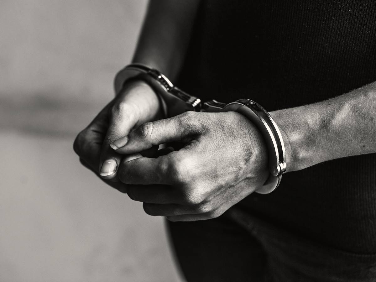 Criminal in handcuffs Criminal in handcuffs