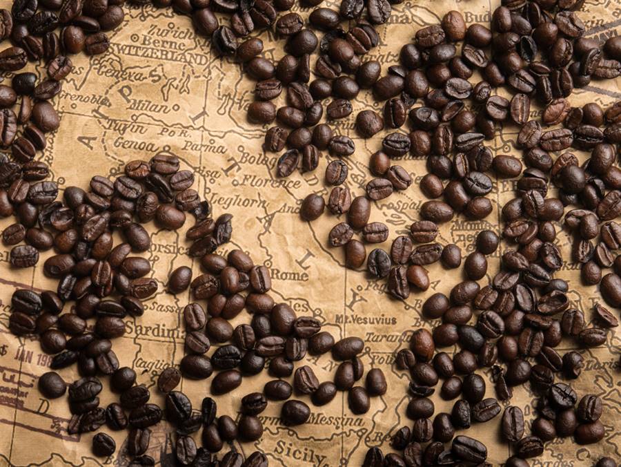 Concept of coffee beans on the map of Italy.