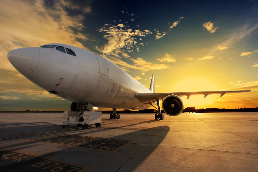 Airplane at sunset - back lit Airplane at sunset - back lit