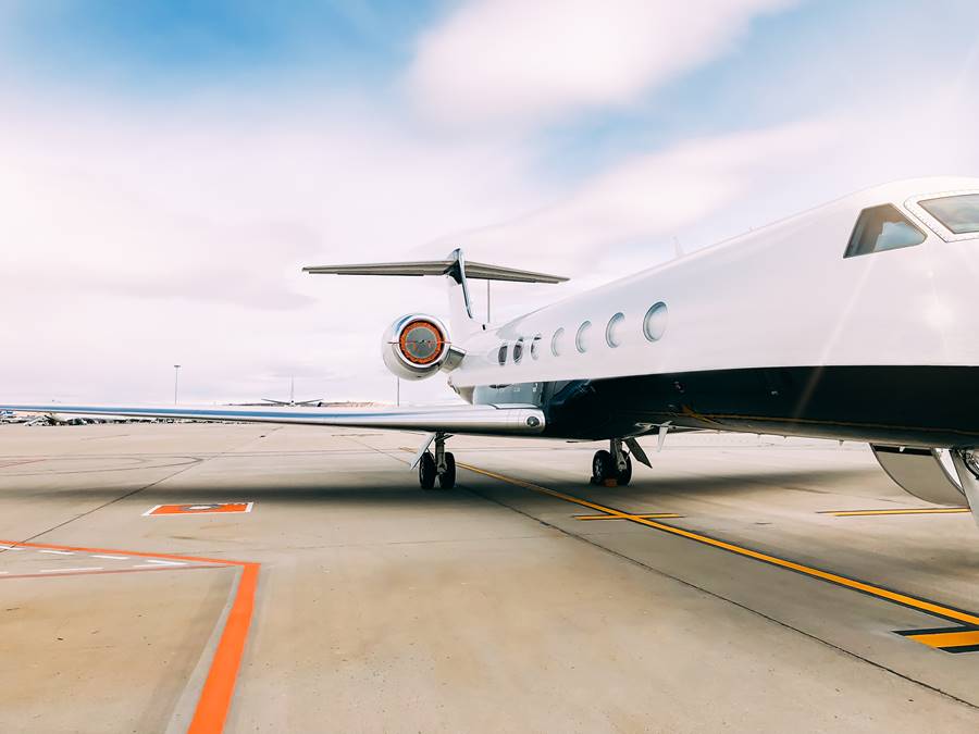 Private luxury jet at the airport terminal Private luxury jet at the airport terminal runway