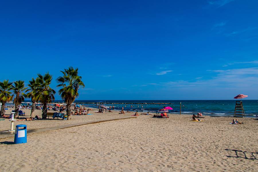 beautiful seaside landscape with a beach in the Spanish city of Alicante on a warm sunny day