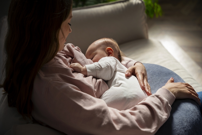 high-angle-mother-with-cute-newborn