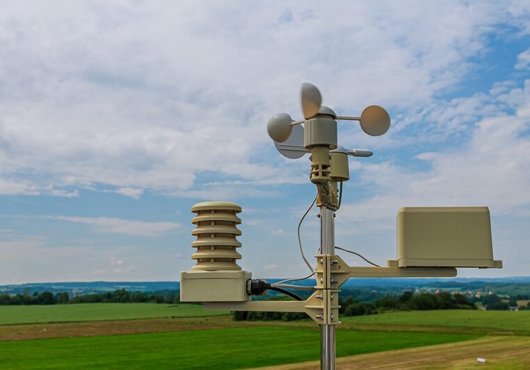 Meterological weather station wind meter anemometer on sky background.