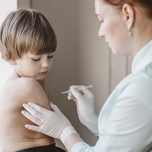 doctor-with-child-getting-vaccine