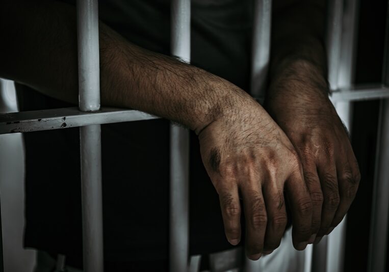 Hands of men desperate to catch the iron prison,prisoner concept,thailand people,Hope to be free.
