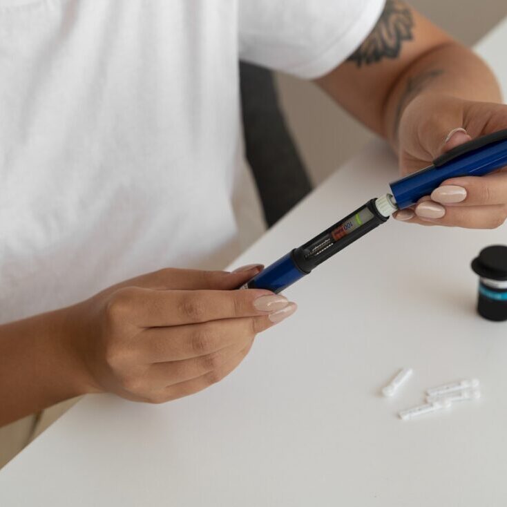 high-angle-diabetic-woman-checking-her-glucose-level