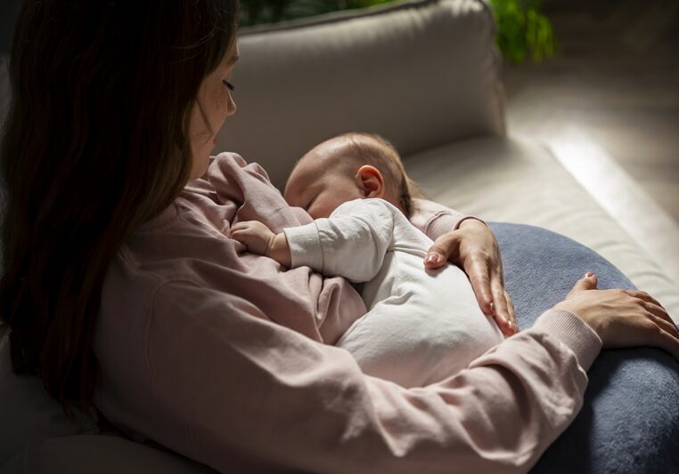 high-angle-mother-with-cute-newborn
