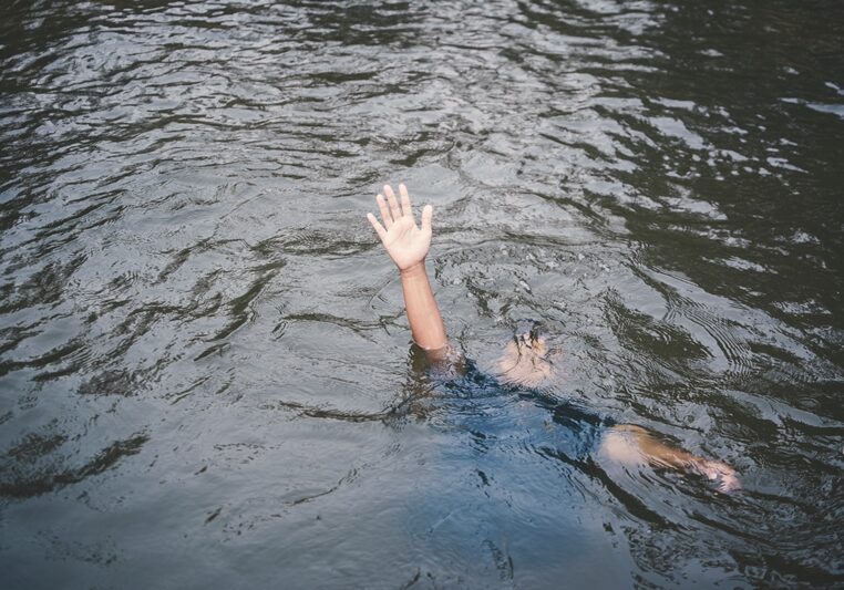 high-angle-view-man-drowning-lake