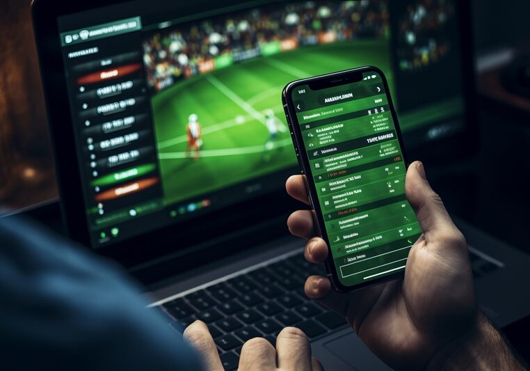 multitasking-sports-enthusiast-bets-excitement-unfold-mobile-laptop-screens