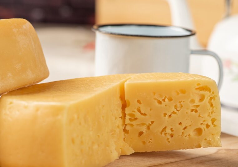Breakfast table in Brazil, with semi-cured cheese and accessories, selective focus.
