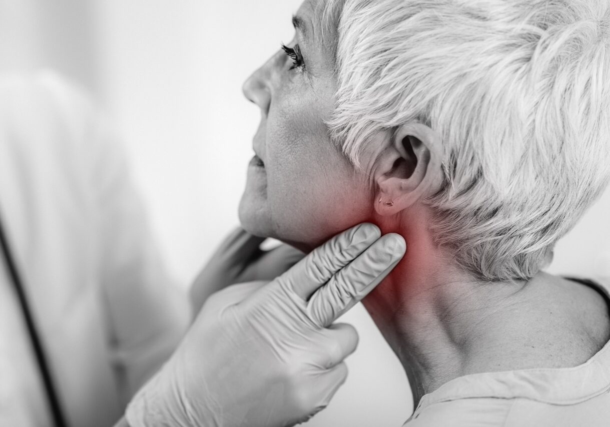Thyroid gland control. Endocrinology doctor examining senior woman at a clinic.